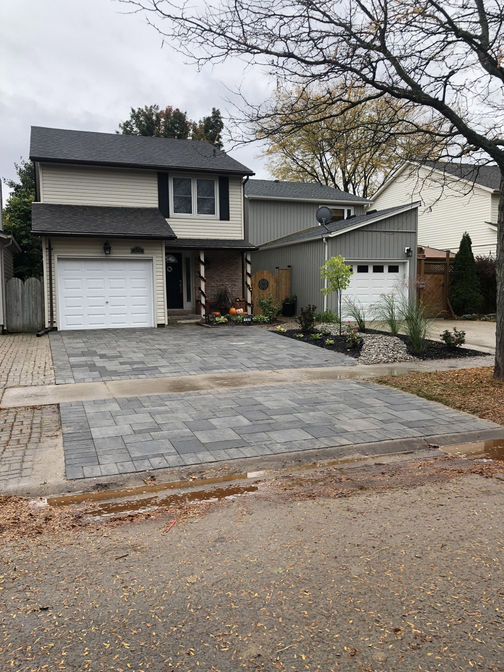 Interlocking brick driveway. A paver driveway project in London Ontario region by O'Connor Stone & Landscape, a contractor.