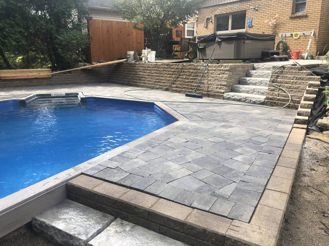 Faux stone steps, walls and paver pool deck. A fuax stone and paver project by the London Ontario based O'Connor Stone & Landscape